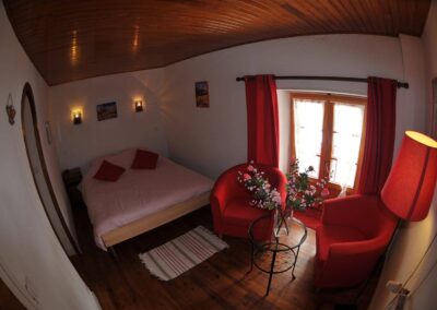 Double bed and sitting area in the Karakoram room