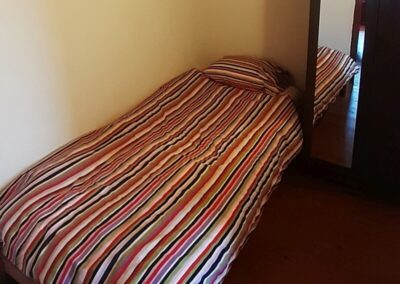 Eenpersoonsbed in kamer Karakoram