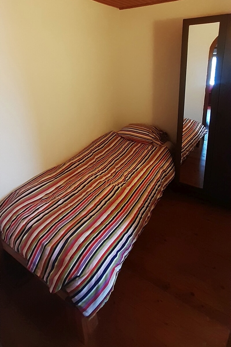 Eenpersoonsbed in kamer Karakoram